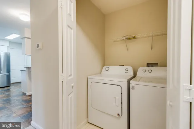 a view of bathroom with a washer and dryer