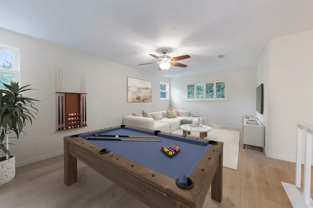 a living room with furniture and a table