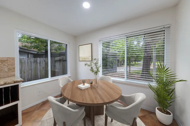 a view of a dining room with furniture window and outside view