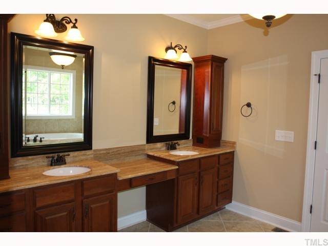 3436 Griffice Mill Road Raleigh, NC 27610 - Photo 5 of 10 a bathroom with a sink vanity and a mirror