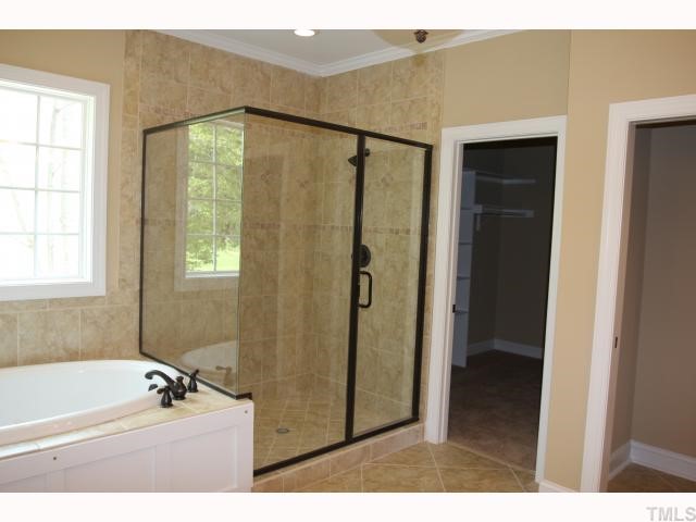 3436 Griffice Mill Road Raleigh, NC 27610 - Photo 6 of 10 a bathroom with a tub a sink and a shower