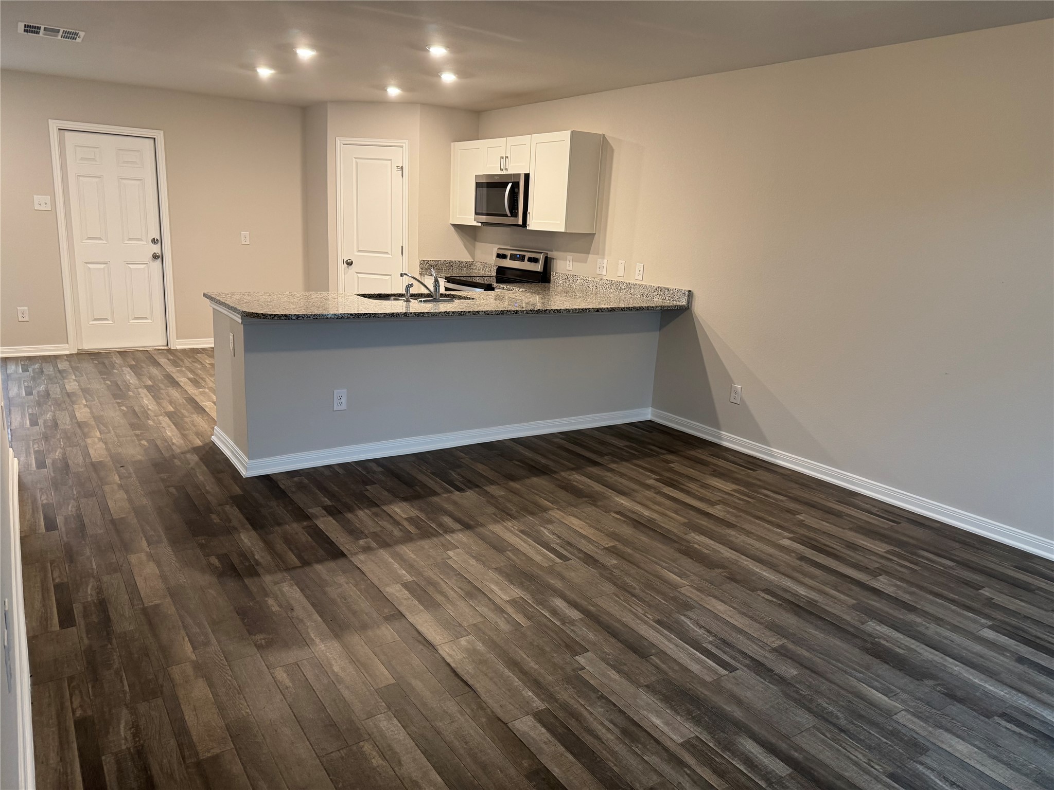 15520 Taylorcrest Drive Conroe, TX 77306 - Photo 12 of 24 a kitchen with a sink and cabinets