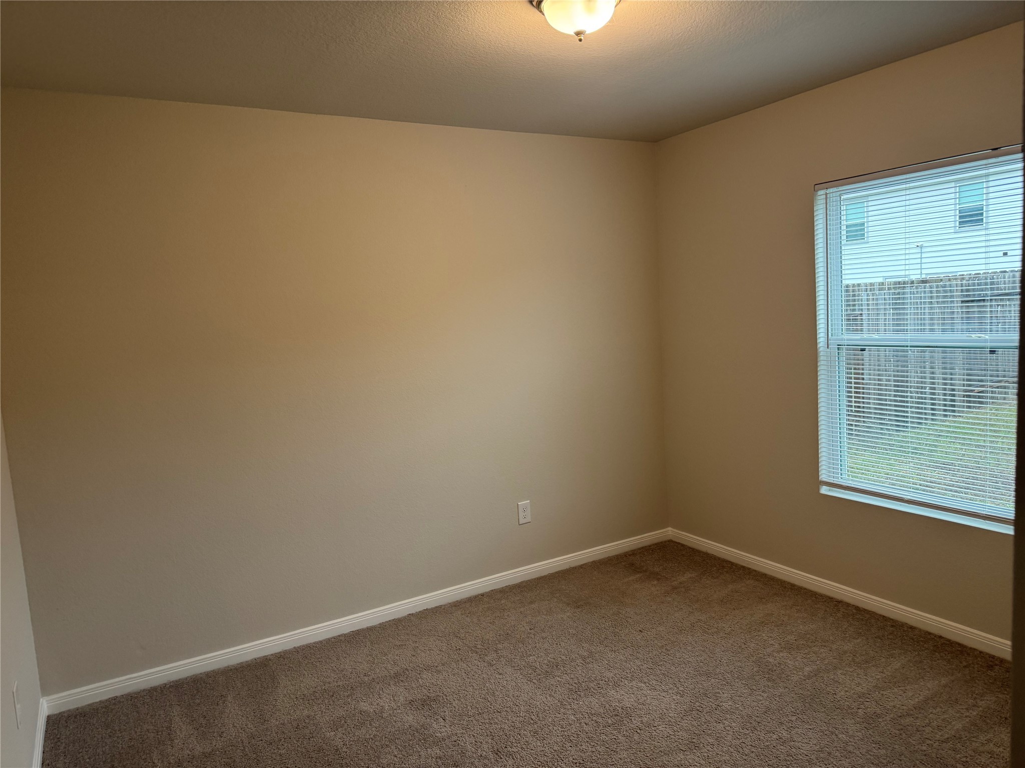 15520 Taylorcrest Drive Conroe, TX 77306 - Photo 13 of 24 an empty room with a window