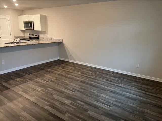 a view of kitchen sink and microwave