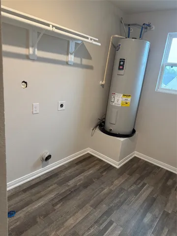 a view of a storage & utility room with wooden floor
