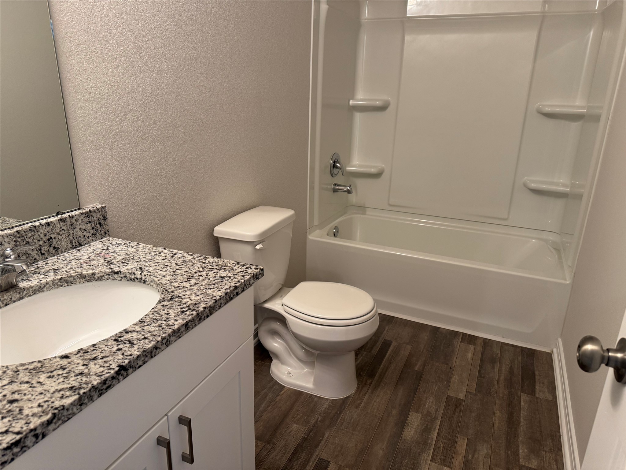 15520 Taylorcrest Drive Conroe, TX 77306 - Photo 20 of 24 a bathroom with a granite countertop sink toilet and shower