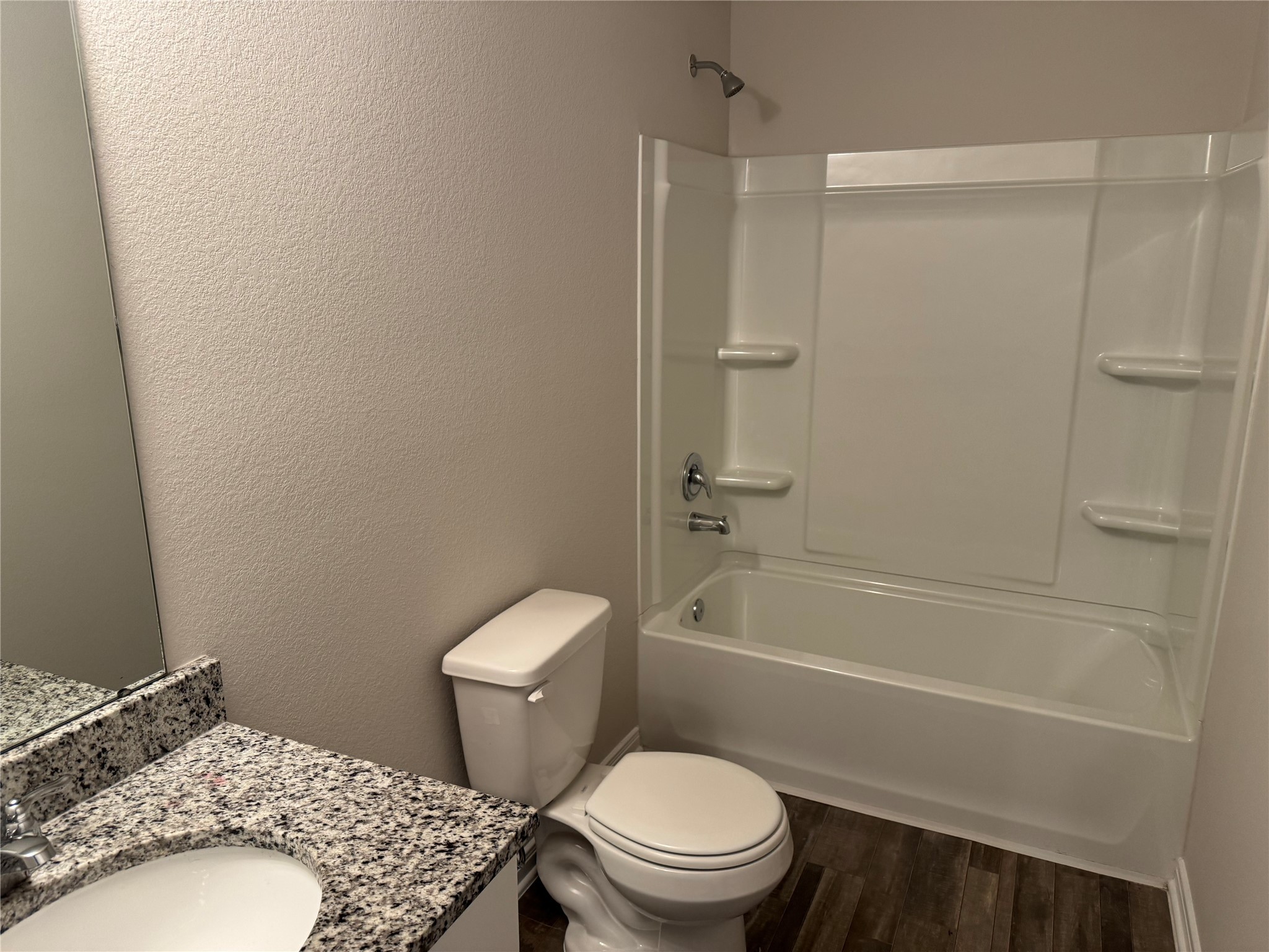 15520 Taylorcrest Drive Conroe, TX 77306 - Photo 21 of 24 a white toilet sitting next to a bath tub