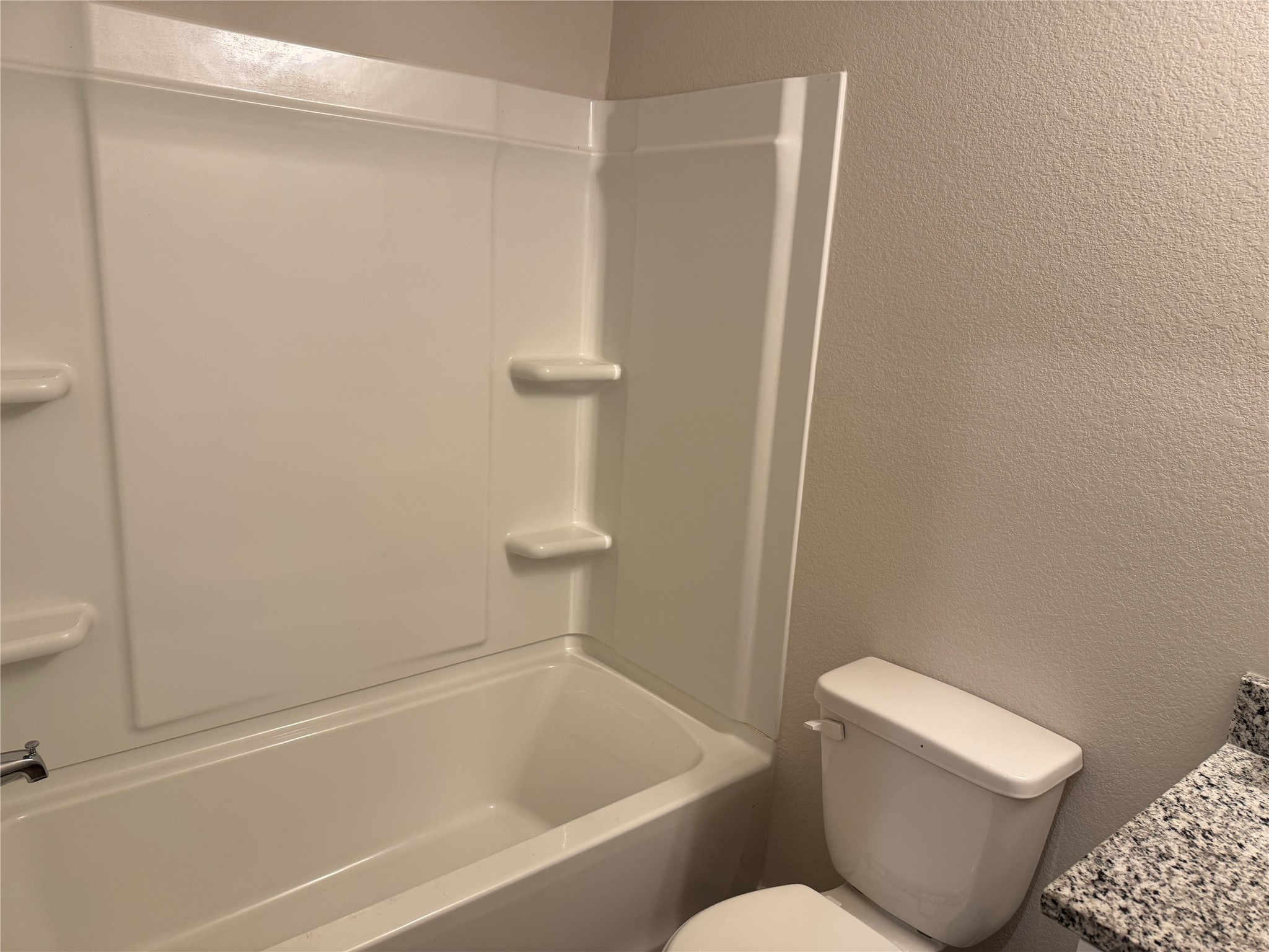 15520 Taylorcrest Drive Conroe, TX 77306 - Photo 24 of 24 a white toilet sitting next to a bath tub