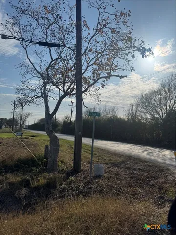 a view of a backyard of the house