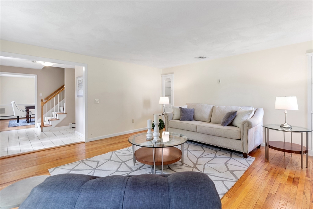 4 Bicentennial Drive Lexington, MA 02421 - Photo 12 of 35 a living room with furniture and a wooden floor