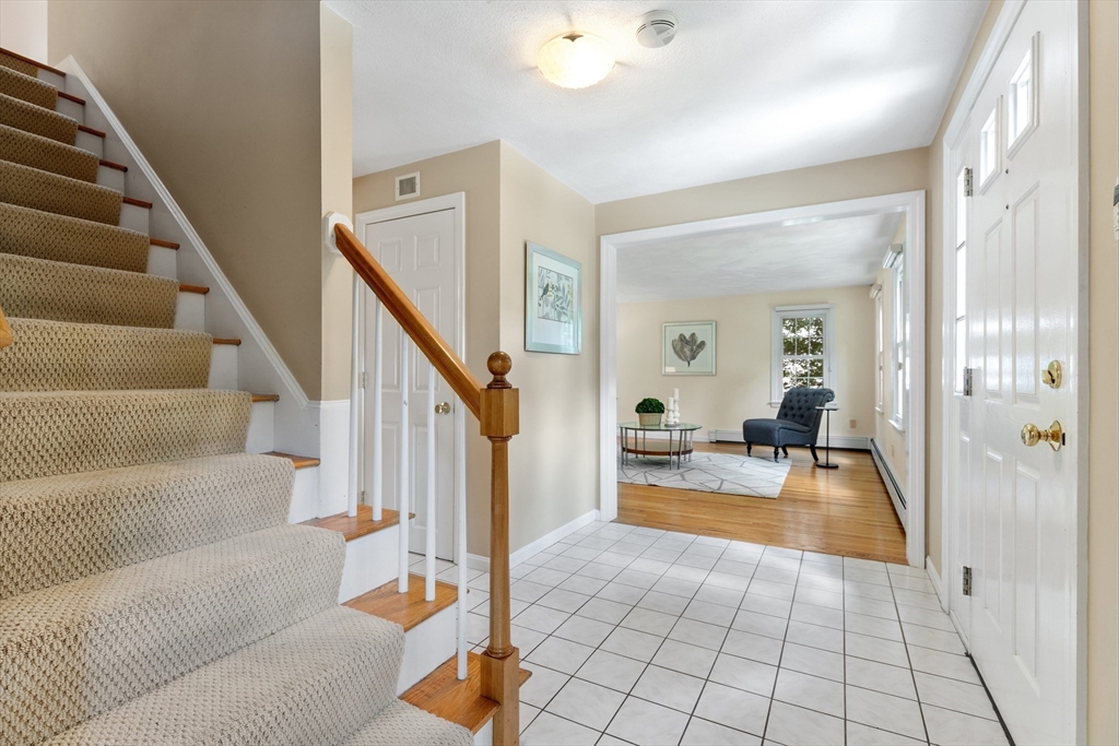 4 Bicentennial Drive Lexington, MA 02421 - Photo 13 of 35 a view of a livingroom with furniture and staircase
