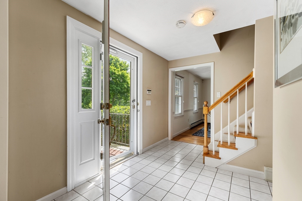 4 Bicentennial Drive Lexington, MA 02421 - Photo 14 of 35 a view of an entryway with wooden floor and door