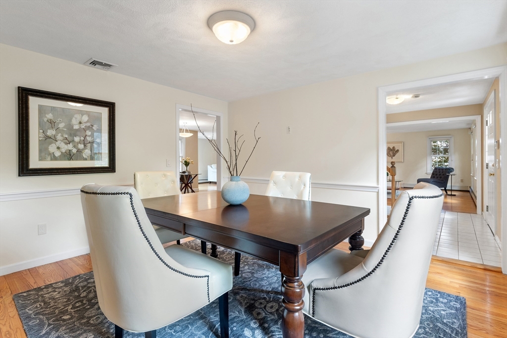 4 Bicentennial Drive Lexington, MA 02421 - Photo 16 of 35 a view of a dining room with furniture and wooden floor