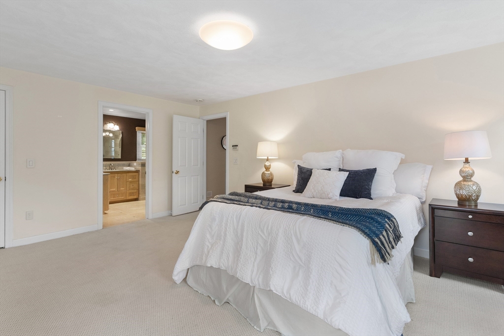 4 Bicentennial Drive Lexington, MA 02421 - Photo 20 of 35 a spacious bedroom with a bed and cabinets