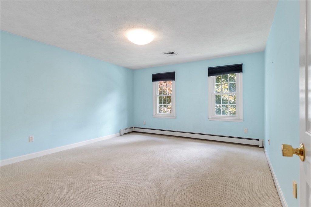 4 Bicentennial Drive Lexington, MA 02421 - Photo 23 of 35 an empty room with windows