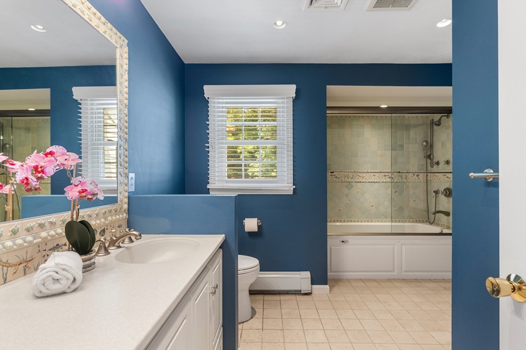 4 Bicentennial Drive Lexington, MA 02421 - Photo 26 of 35 a bathroom with a sink a toilet and shower