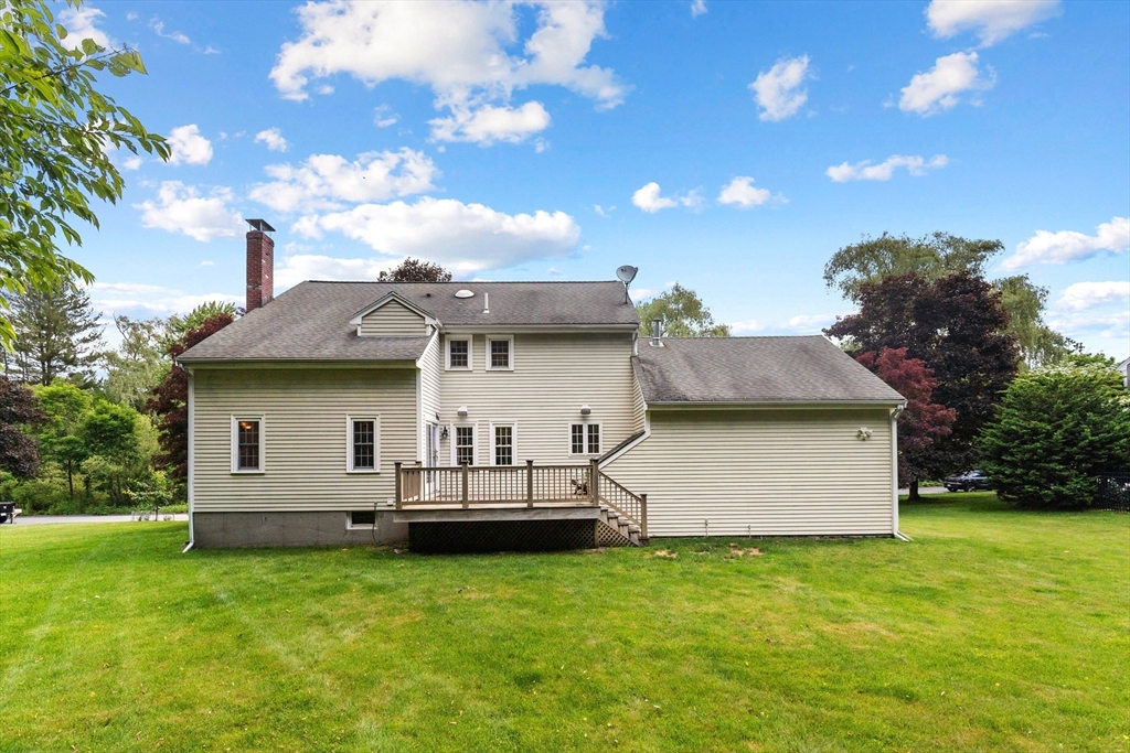 4 Bicentennial Drive Lexington, MA 02421 - Photo 33 of 35 a view of a house with a backyard
