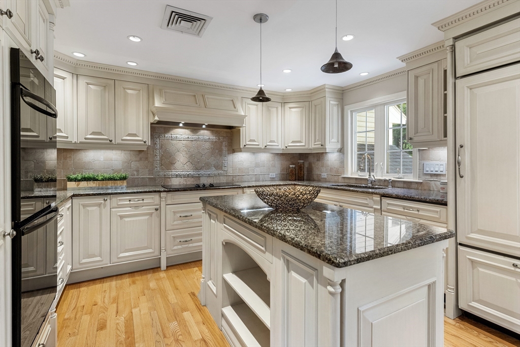 4 Bicentennial Drive Lexington, MA 02421 - Photo 6 of 35 a kitchen with kitchen island granite countertop a sink stainless steel appliances and cabinets