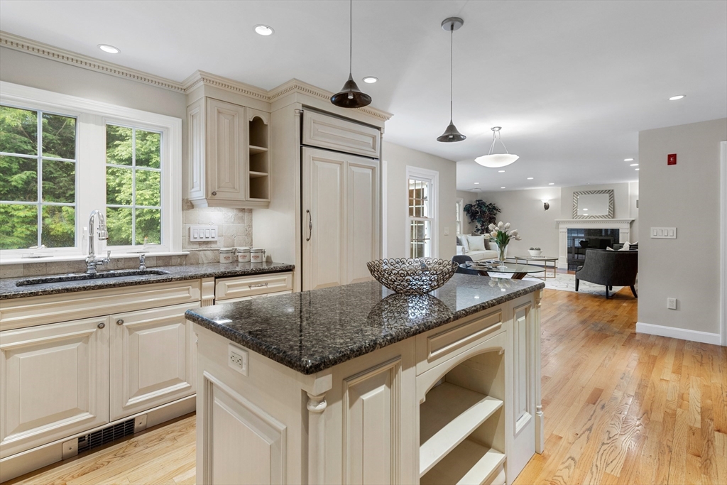4 Bicentennial Drive Lexington, MA 02421 - Photo 7 of 35 a kitchen with stainless steel appliances granite countertop a sink a stove and a wooden floors