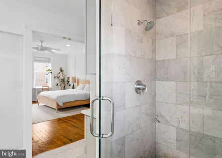 a en suite bathroom with a white bath tub and shower