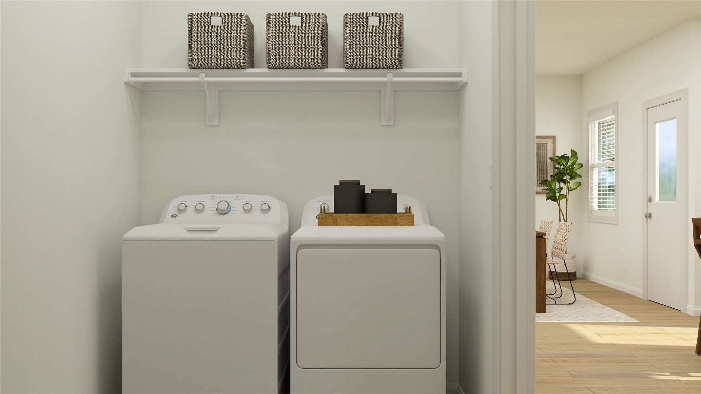 18017 Prairie Falcon Way Pflugerville, TX 78660 - Photo 23 of 26 a utility room with dryer and washer