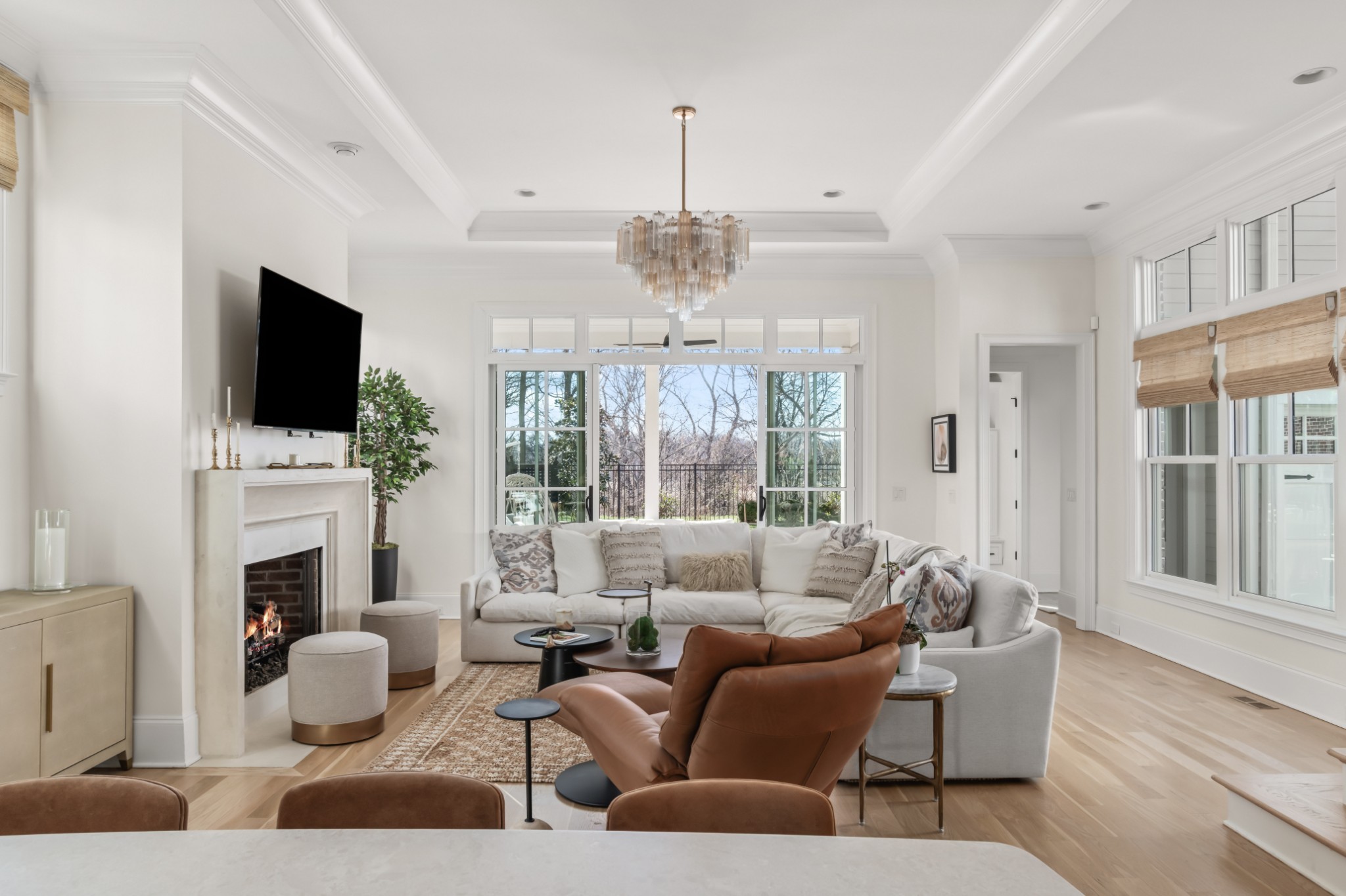 155 Splendor Ridge Drive Franklin, TN 37064 - Photo 14 of 70 a living room with furniture a fireplace and a flat screen tv