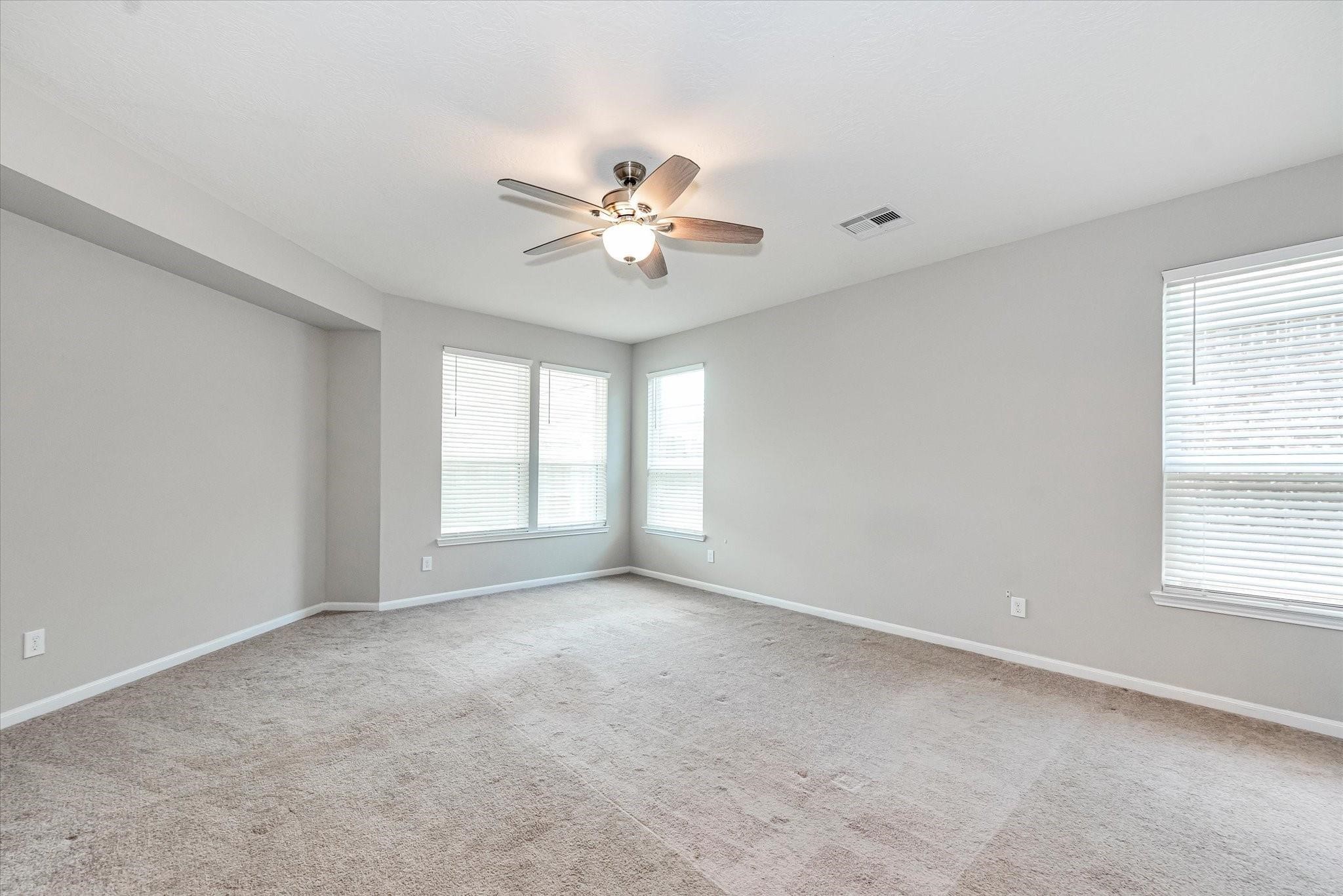 1111 Swinford Court Conroe, TX 77304 - Photo 10 of 21 a view of room with a ceiling fan and window