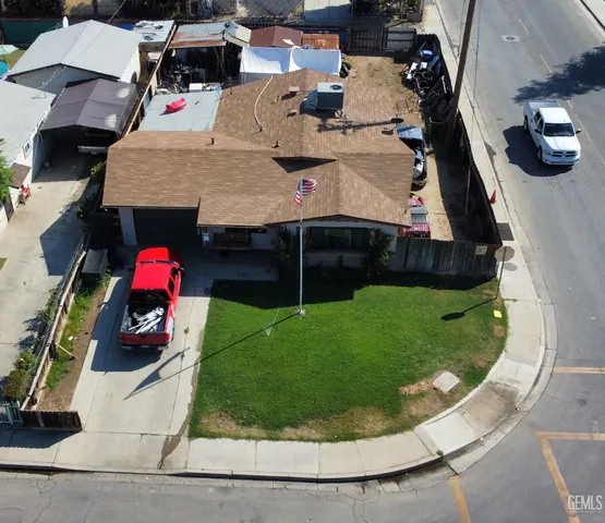 an aerial view of a house with a swimming pool