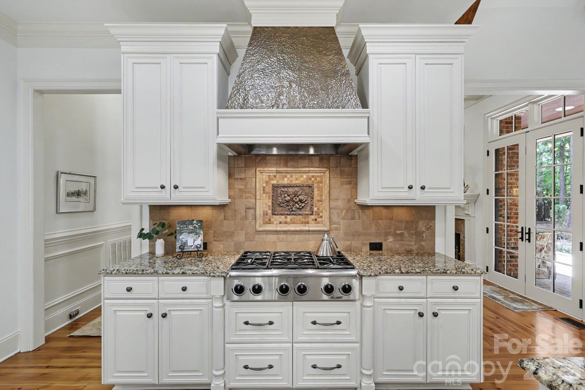508 Hideaway Ridge Court Matthews, NC 28105 - Photo 20 of 47 a kitchen with granite countertop a stove sink and cabinets