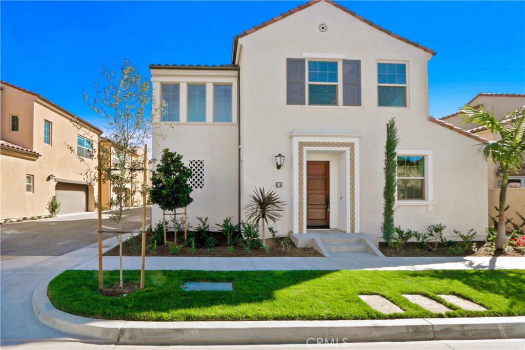 174 Augustine Irvine, CA 92618 - Photo 1 of 1 a front view of a house with a yard