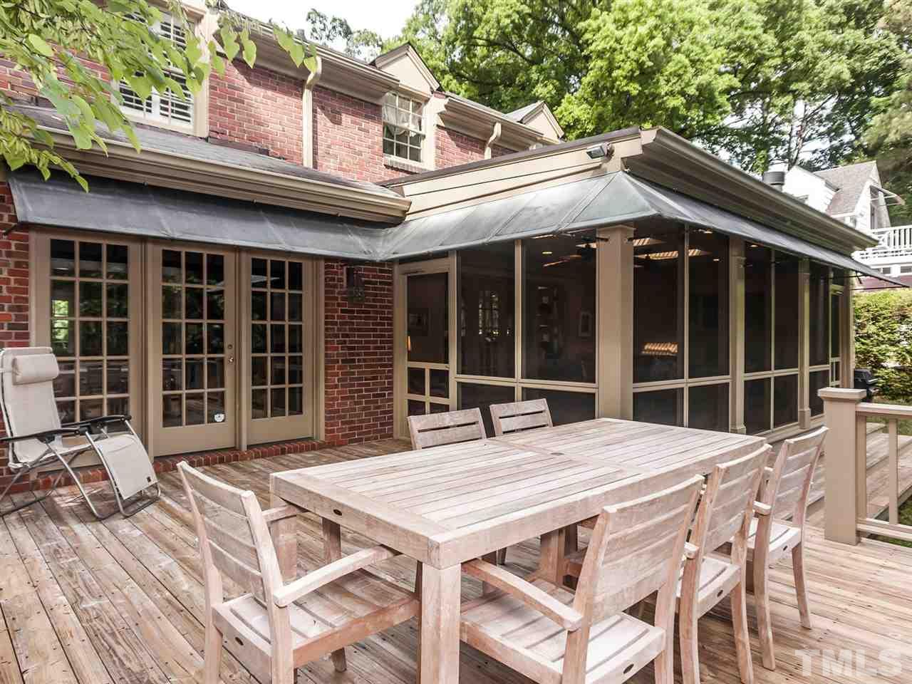 1606 Craig Street Raleigh, NC 27608 - Photo 22 of 24 a patio with a table and chairs and potted plants