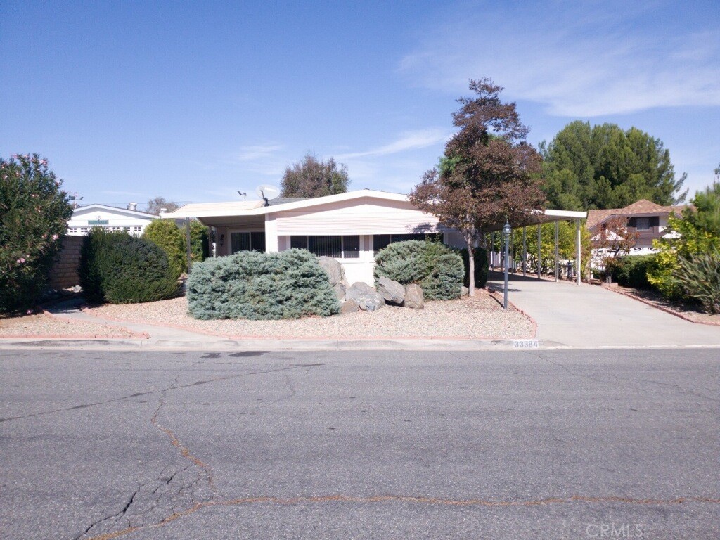 33384 Windmill Road Wildomar, CA 92595 - Photo 1 of 1 a view of a street with a houses