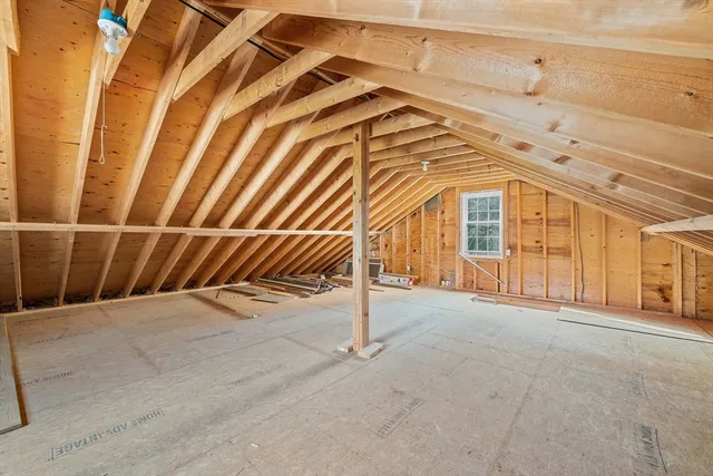a view of an empty room with stairs
