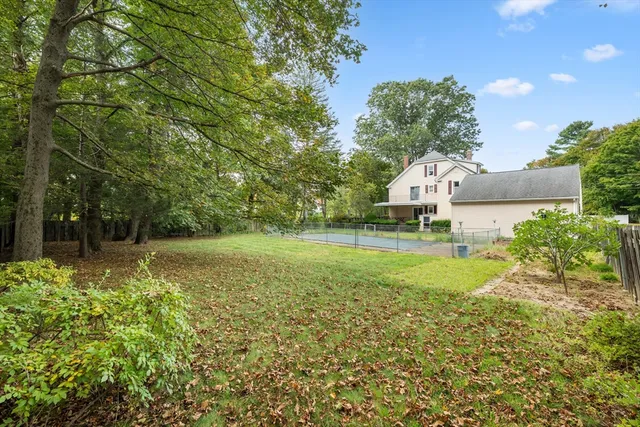 aerial view of a house with a yard