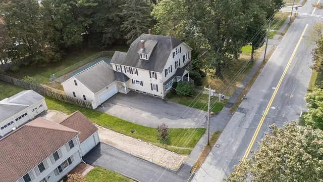 an aerial view of residential houses with outdoor space