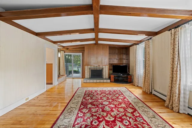 a very nice looking room with a fireplace and a rug