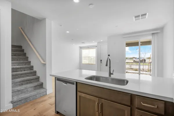 a kitchen with sink and window