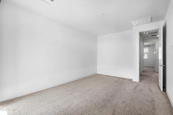 a view of an empty room and closet