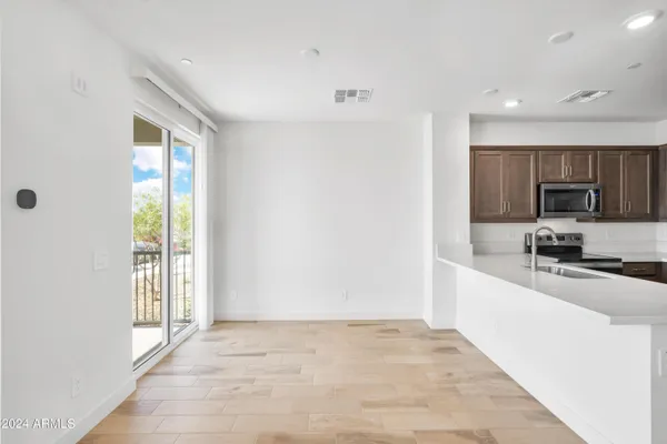 a view of a kitchen with a sink and a window