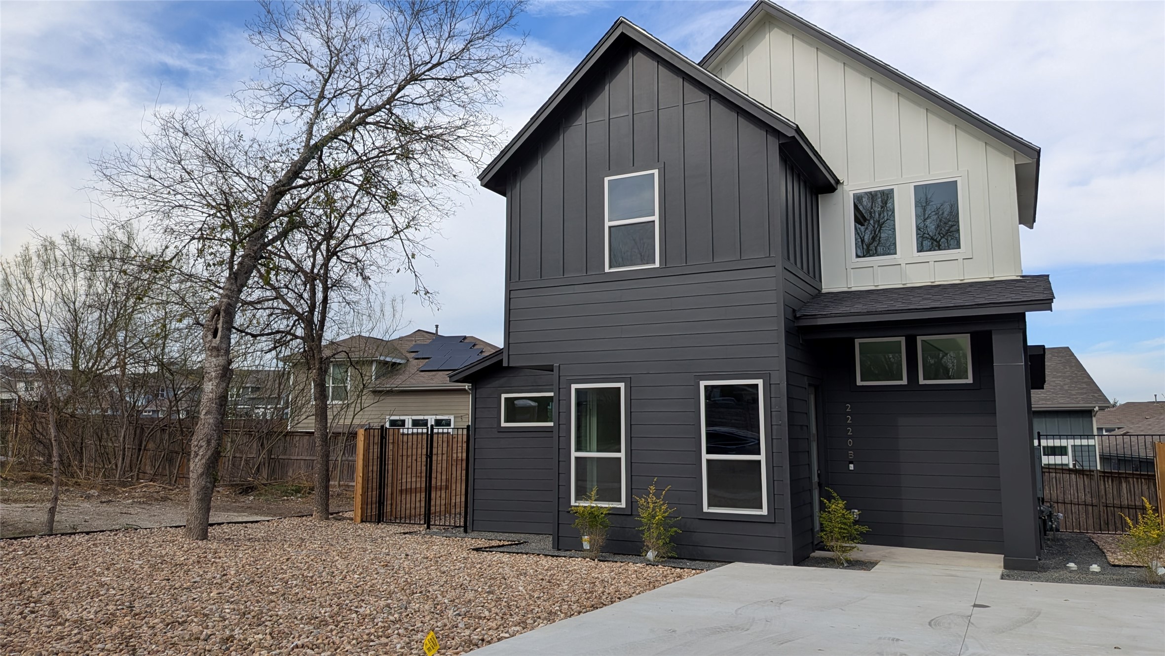 a front view of a house with glass windows