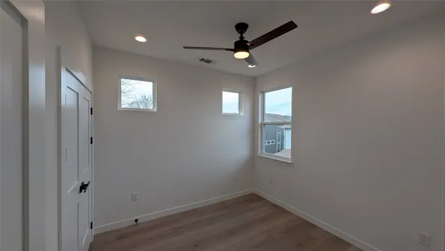 a view of an empty room with a window