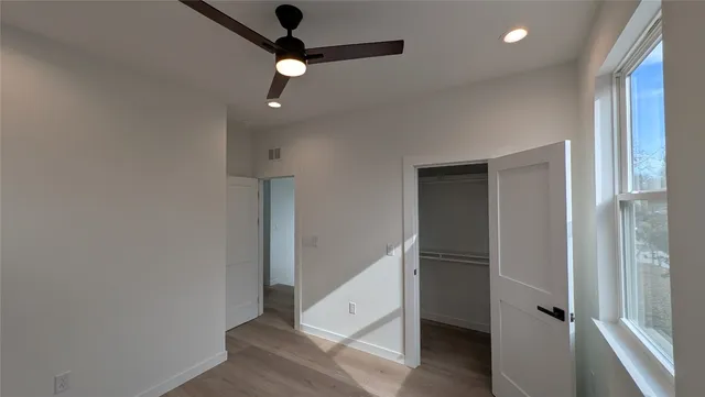 a view of a hallway with windows