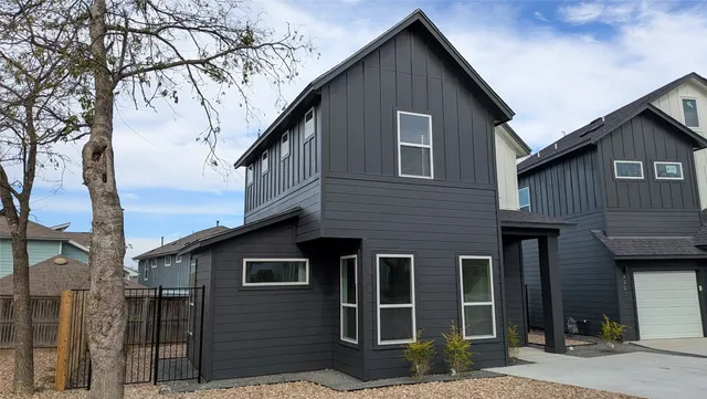 a view of a house and a yard