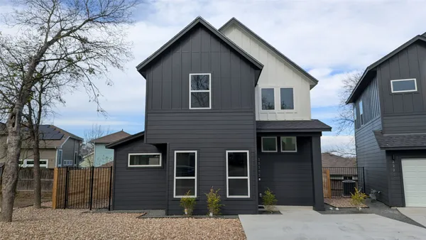 a front view of a house with yard