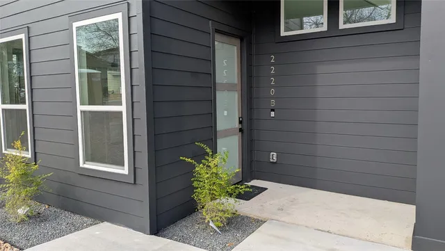 a potted plant sitting in front of a door