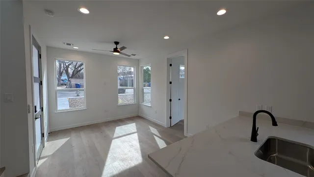 a bathroom with a sink a toilet and a tub