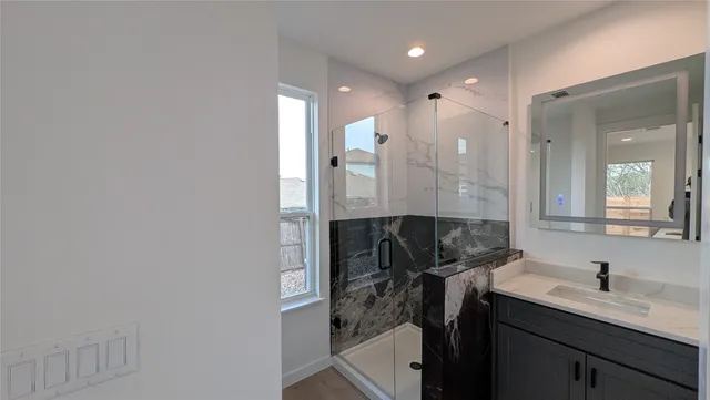 a bathroom with a sink and a mirror