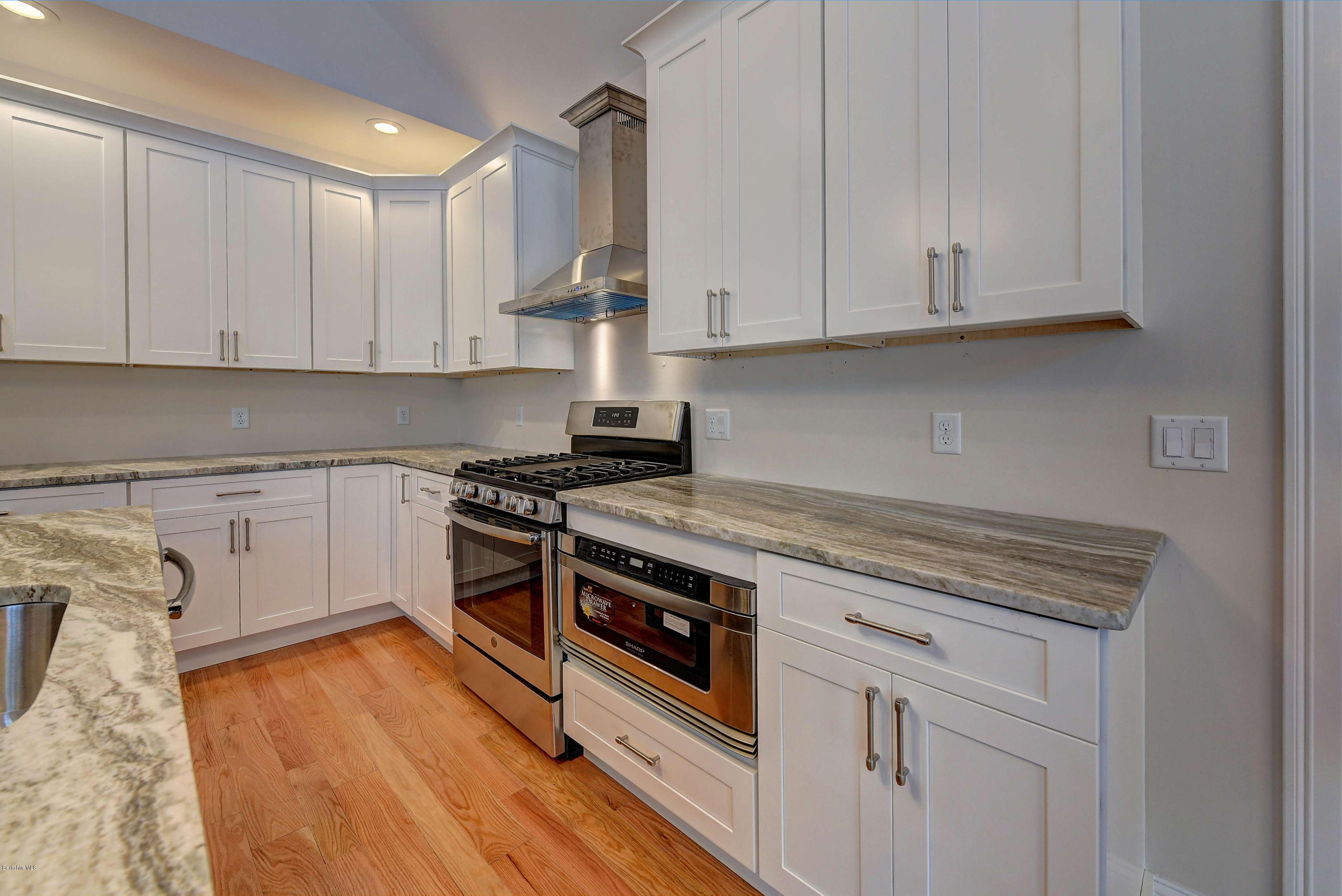 1 B West Dale Road Stockbridge, MA 01262 - Photo 11 of 26 a kitchen with granite countertop white cabinets and white appliances