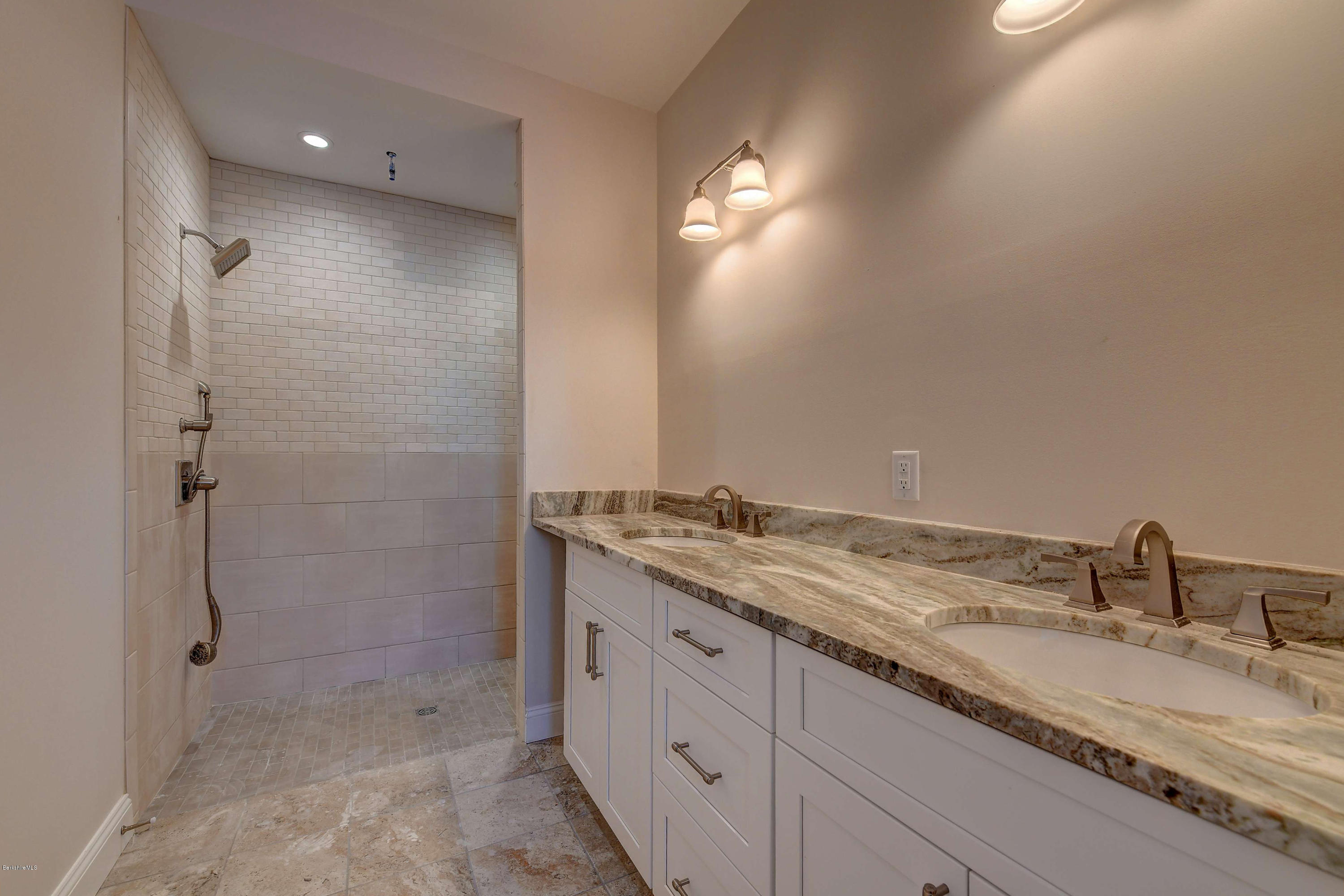 1 B West Dale Road Stockbridge, MA 01262 - Photo 17 of 26 a bathroom with a granite countertop sink two mirror and shower