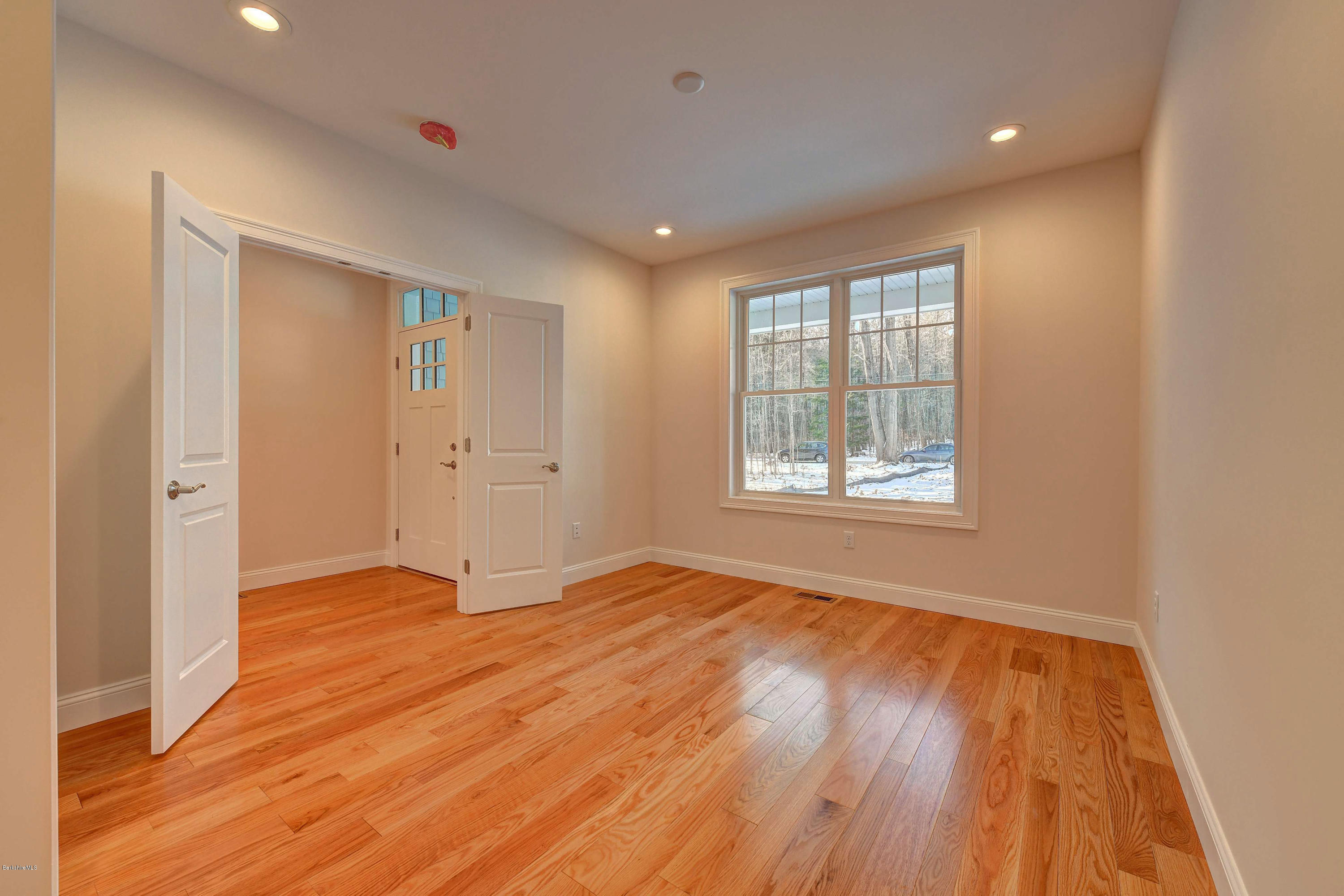 1 B West Dale Road Stockbridge, MA 01262 - Photo 18 of 26 a view of an empty room with wooden floor and a window